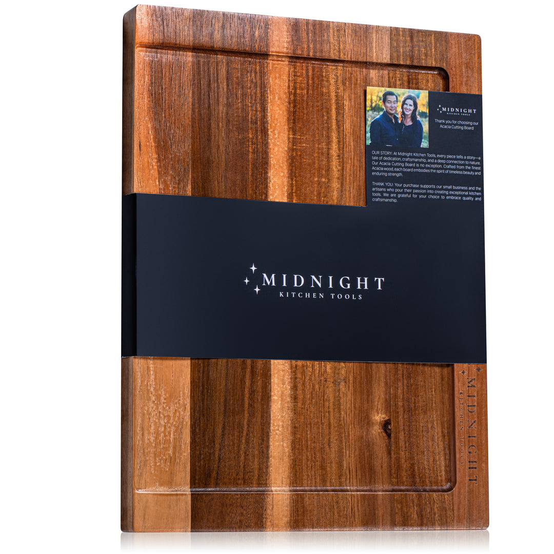Wooden cutting board with Midnight Kitchen Tools branding on a white background
